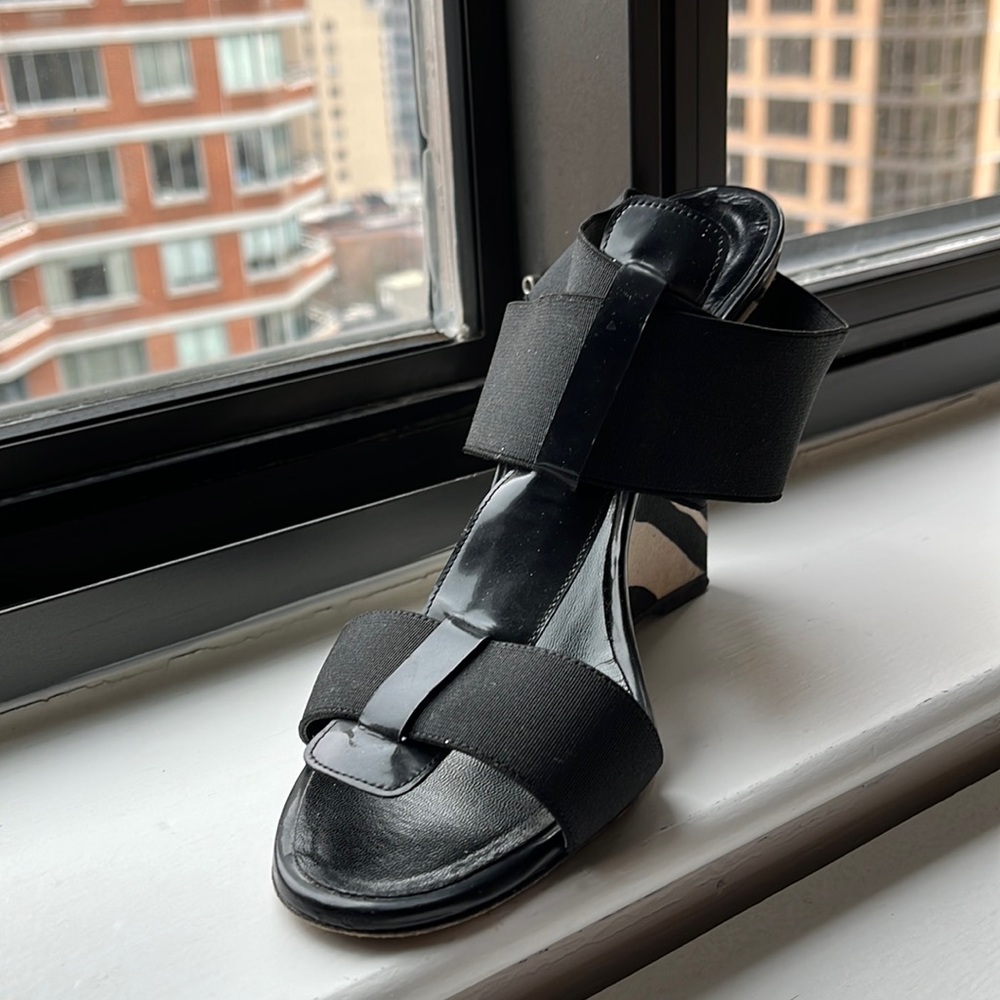 Manola Blahnik black and white patent stretch band strappy wedge.